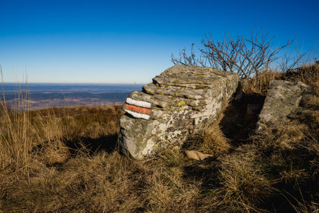 Old stone wall on top of the mountain with blue sky in backgroundの写真素材