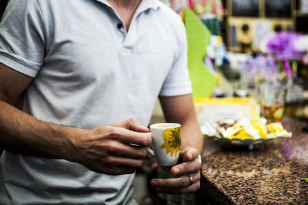 Drinking an original italian espresso coffeeの写真素材