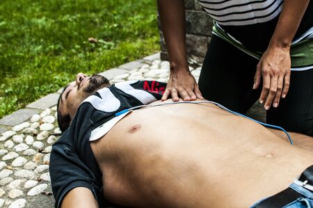 Cardiopulmonary resuscitation with CPR and defibrillatorの写真素材