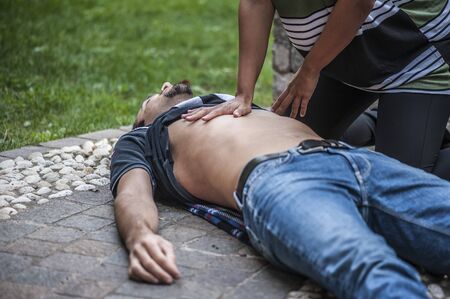 Cardiopulmonary resuscitation with CPR and defibrillatorの写真素材