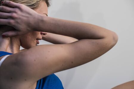 girl making fitness exercises, stretching, weight lifting and abdominals