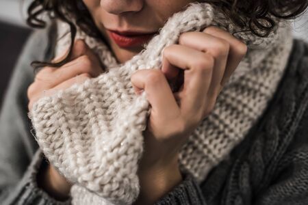 woman with a hot scarf in wool in a gelid winter