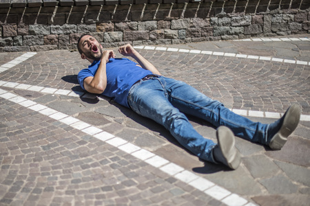 Guy searching help during a heart attackの写真素材