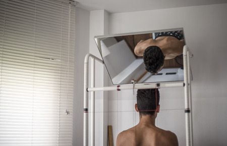 orthopedic physiotherapist check body growth of young athleteの写真素材