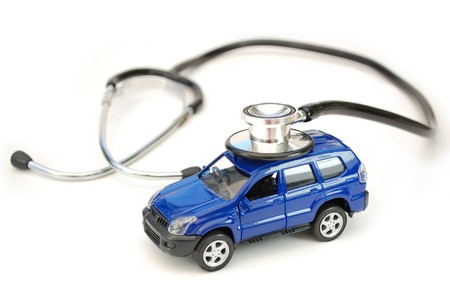 Stethoscope and toy carの写真素材