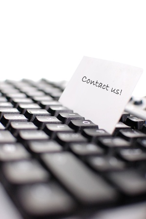 Business card on top of a computer keyboard (shallow depth of field)