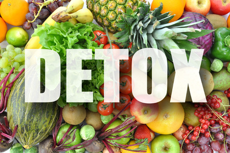Detox text over assorted fruits and vegetablesの写真素材