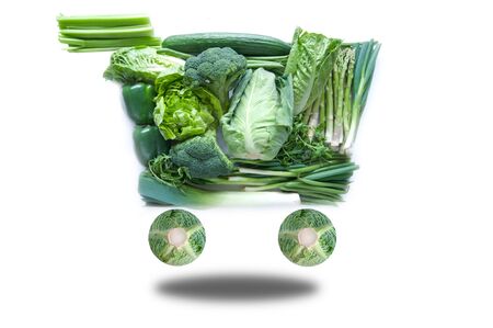 Fresh green groceries in the shape of a shopping cartの写真素材