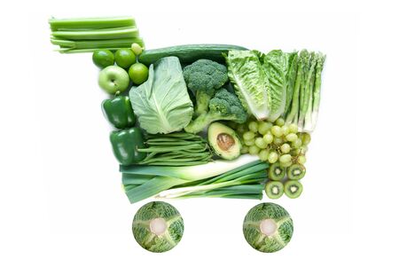 Green fruits and vegetables in the shape of a shopping cart symbolの写真素材