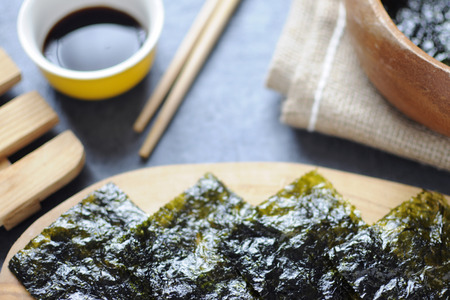 Seaweed wafer snacks on a wooden board closeupの写真素材