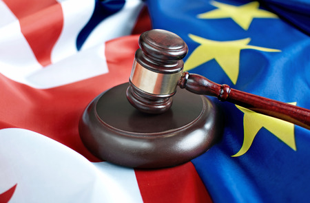 Gavel on top of British and European flagsの写真素材