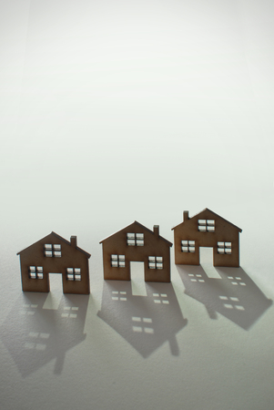 Three small houses in a row with space for textの写真素材