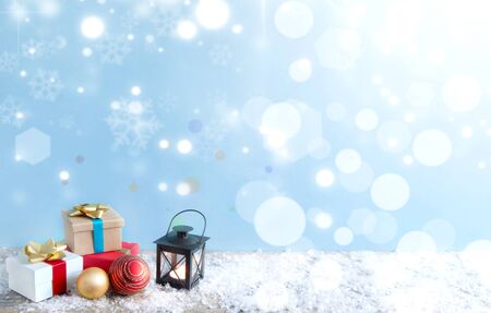 Christmas gifts and decorative lights background with spaceの写真素材