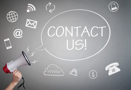 Contact us speech bubble coming out of megaphone surrounded by iconsの写真素材