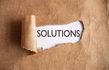 Torn piece of scroll uncovering solutionsの写真素材