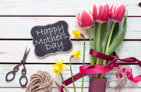 Spring tulip bouquet with mothers day signの写真素材