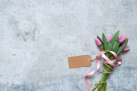 Gift flowers background with blank cardの写真素材