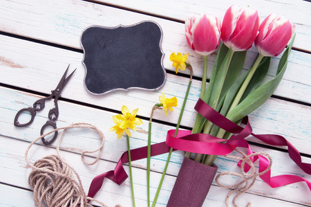 Gift flowers with blank chalkboardの写真素材