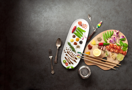 Painters food seasoning palette with colorful herbs' spices and fresh ingredientsの写真素材