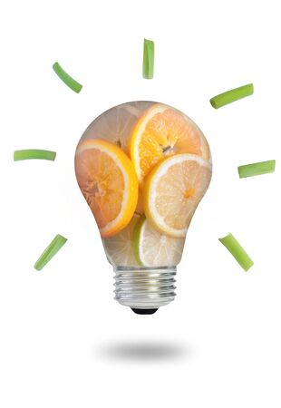 Light bulb made of fruits and vegetables over a white backgroundの写真素材