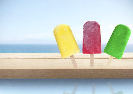 Assorted icecream cones by the sea の写真素材