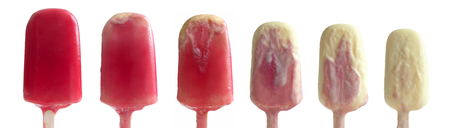 Strawberry ice cream lolly meltingの写真素材