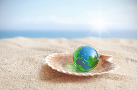 World globe inside an open shellの写真素材