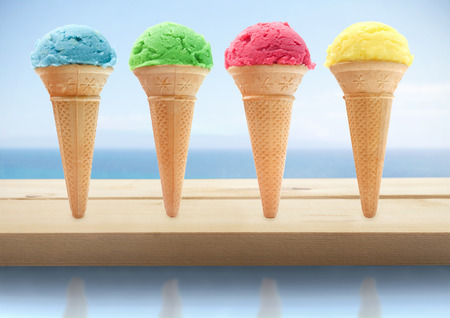 Assorted icecream cones by the seaの写真素材