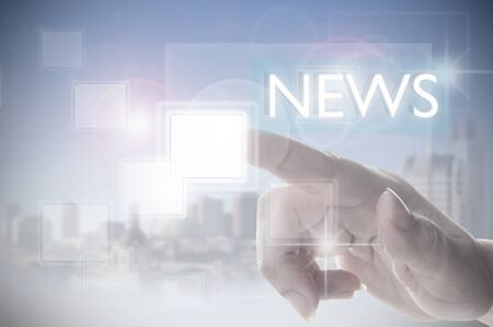 Finger clicking on a news interfaceの写真素材