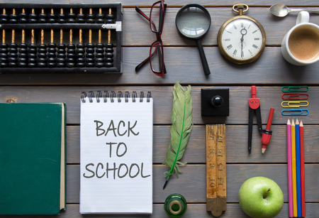 Back to school handwritten on a notepad with stationery itemsの写真素材