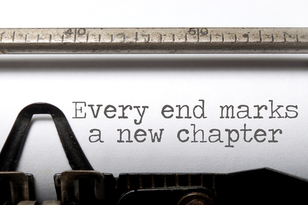 Every end marks a new chapter motivational saying printed on a typewriterの写真素材