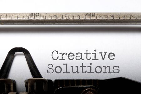 Creative solutions printed on a typewriterの写真素材