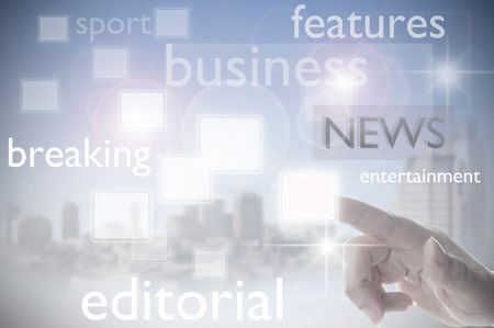 Finger clicking on a news interface の写真素材