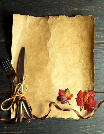 Empty paper scroll with fork and knifeの写真素材