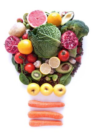 Light bulb made of fruits and vegetables over a white backgroundの写真素材