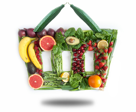 Fruits and vegetables in the shape of a grocery basket の写真素材