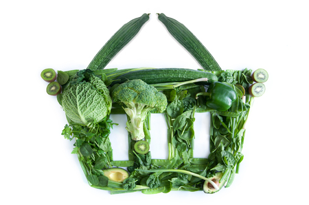 Grocery basket icon made of green fruits and vegetables over a white backgroundの写真素材