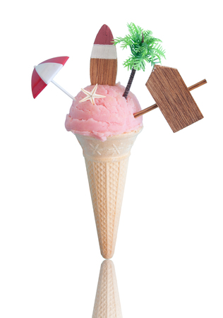 Summer strawberry icecream with beach items over a white backgroundの写真素材