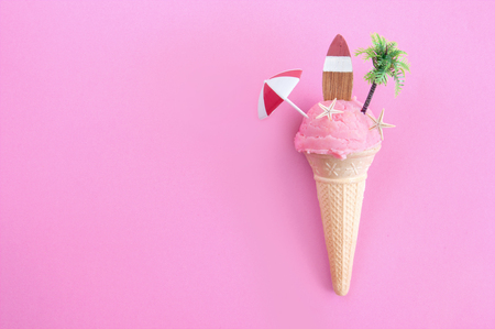 Strawberry icecream with parasol, surfboard and pine treeの写真素材