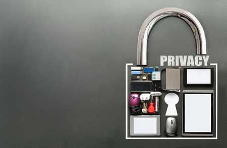 Online privacy, various devices including tablets, computer mouse, usb cards in the shape of a padlock on a chalkboard backgroundの写真素材