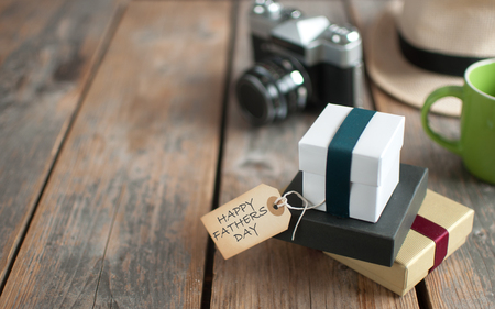 Gifts with fathers day label on a wooden backgroundの写真素材