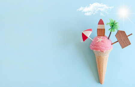 Strawberry icecream with beach items below sun の写真素材