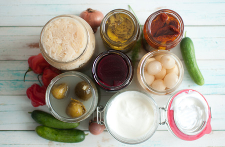 View of open jars with naturally fermented ingredientsの写真素材