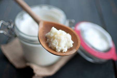 Kefir grains closeup on a wooden spoonの写真素材