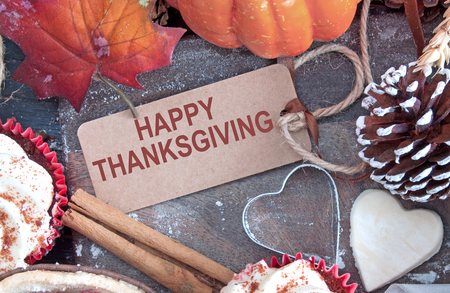 Happy thanksgiving greeting card on a food cutting boardの写真素材