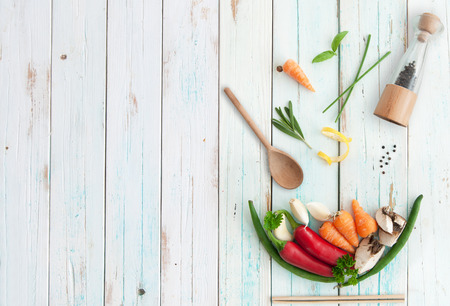 Ingredients in the shape of a soup bowl on a wooden table with spaceの写真素材