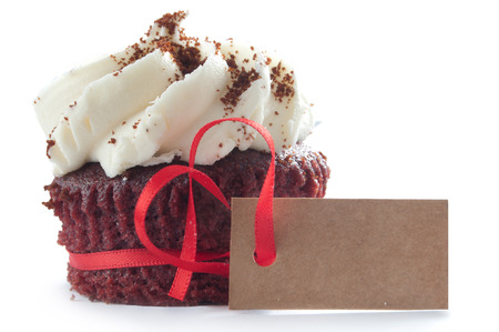 Chocolate cream cupcake with seasonal blank greeting cardの写真素材