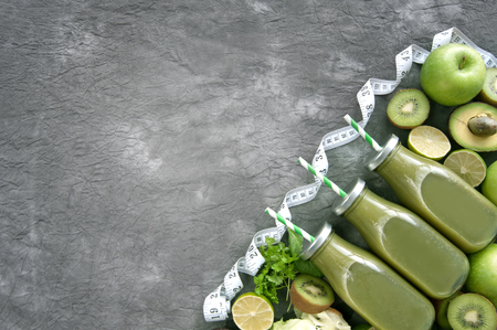 Green bottled smoothies with straws and fresh ingredients の写真素材