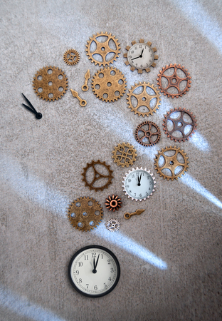 Clock parts including hands gears and cogs in the shape of a question markの写真素材