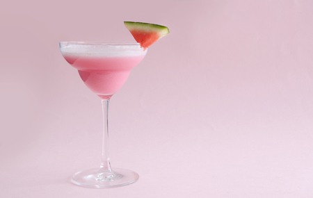 Summer cocktail with red watermelon slice の写真素材